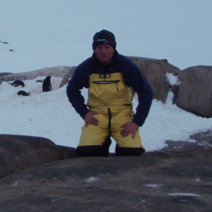 Dean Lewcock with penguins in Antarctica. Dean Lewcock with penguins in Antarctica.